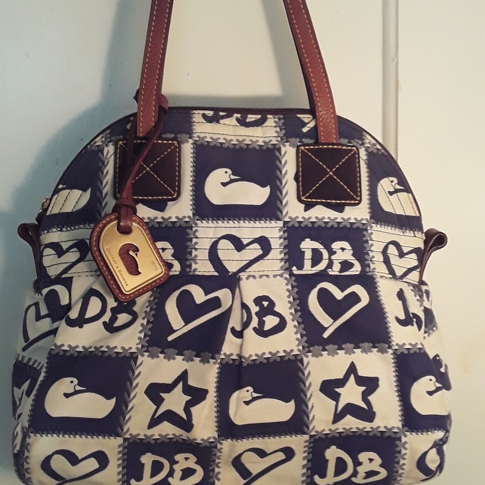 Vintage Dooney and Bourke leather trim shoulder satchel.